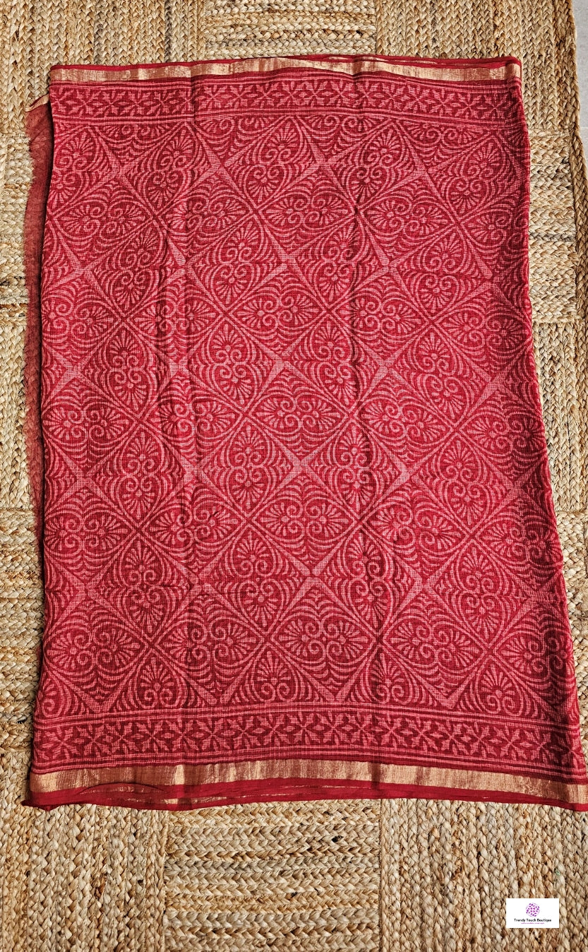 Hand block printed maroon Kota Doria saree with natural dyes, floral and paisley patterns, lightweight and skin-friendly.