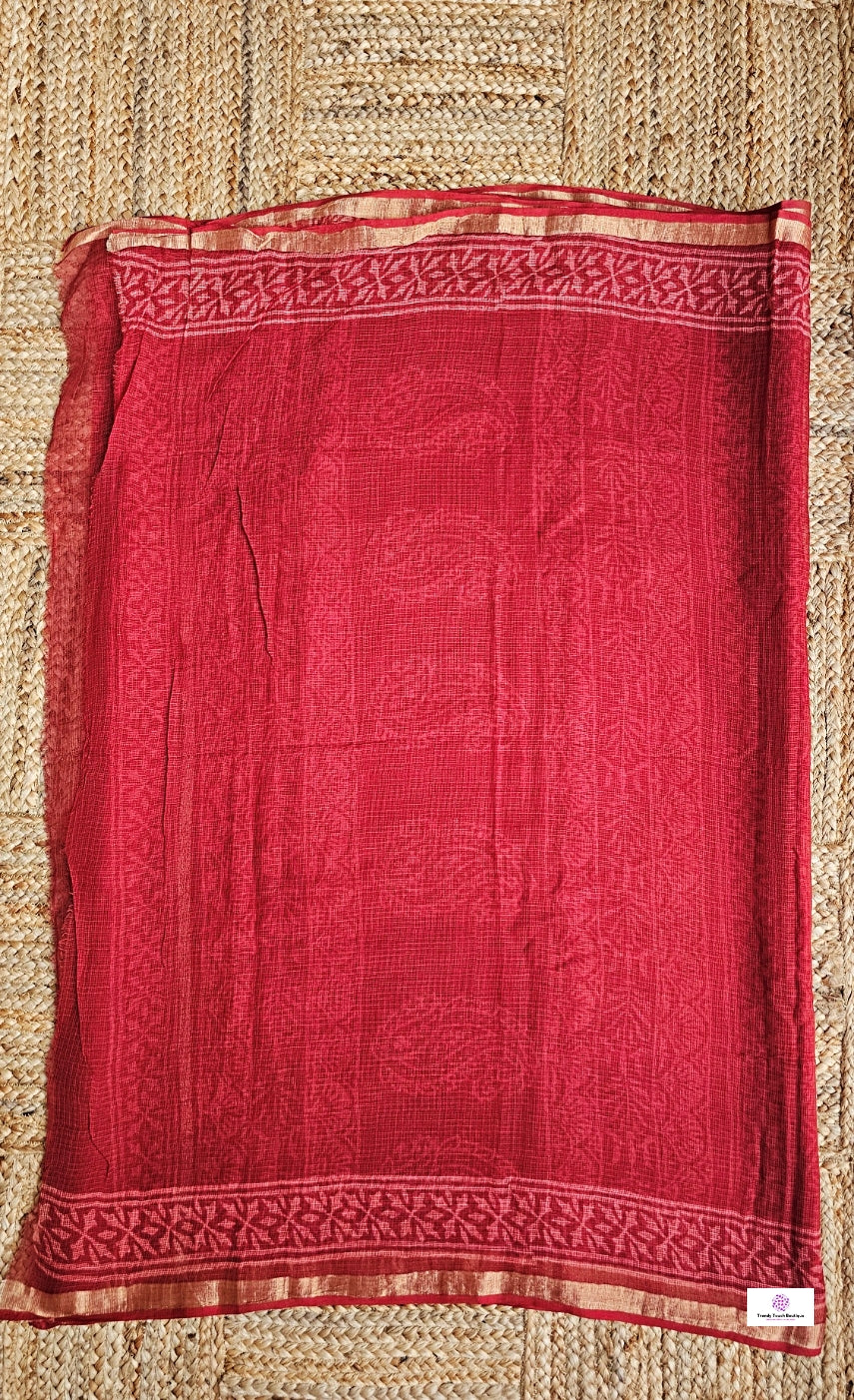 Hand block printed maroon Kota Doria saree with natural dyes, floral and paisley patterns, lightweight and skin-friendly.