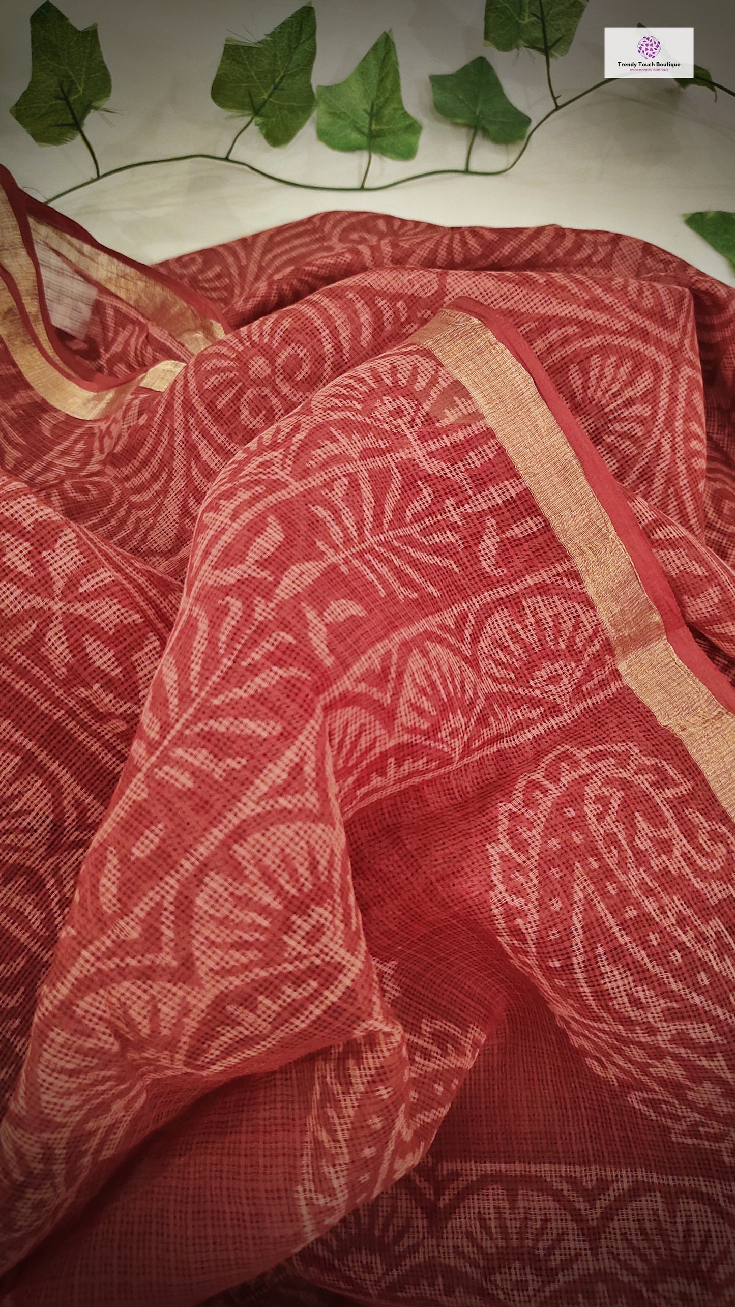 Hand block printed maroon Kota Doria saree with natural dyes, floral and paisley patterns, lightweight and skin-friendly.