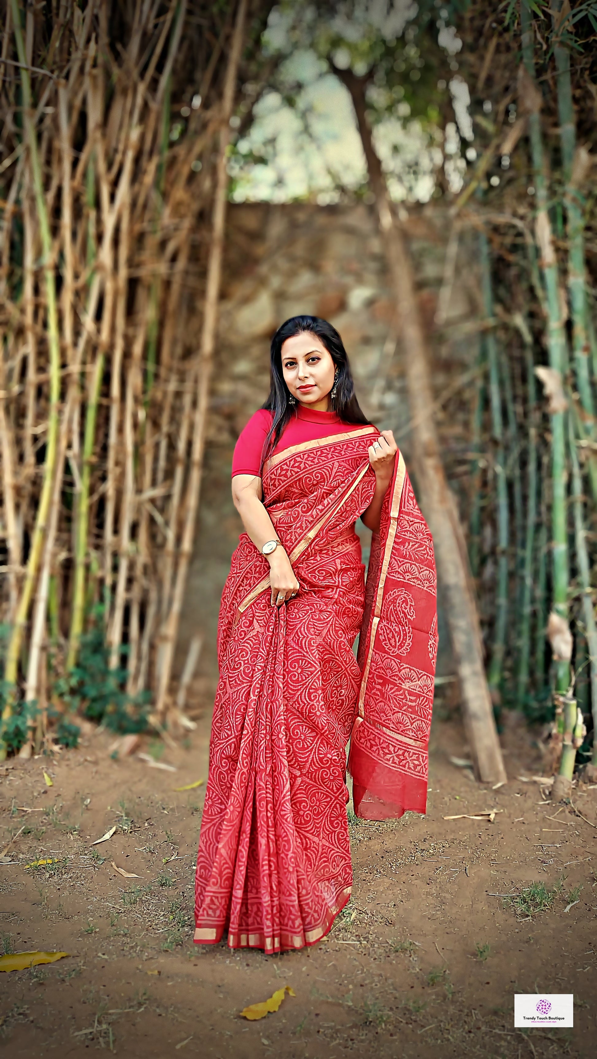 Hand block printed maroon Kota Doria saree with natural dyes, floral and paisley patterns, lightweight and skin-friendly.