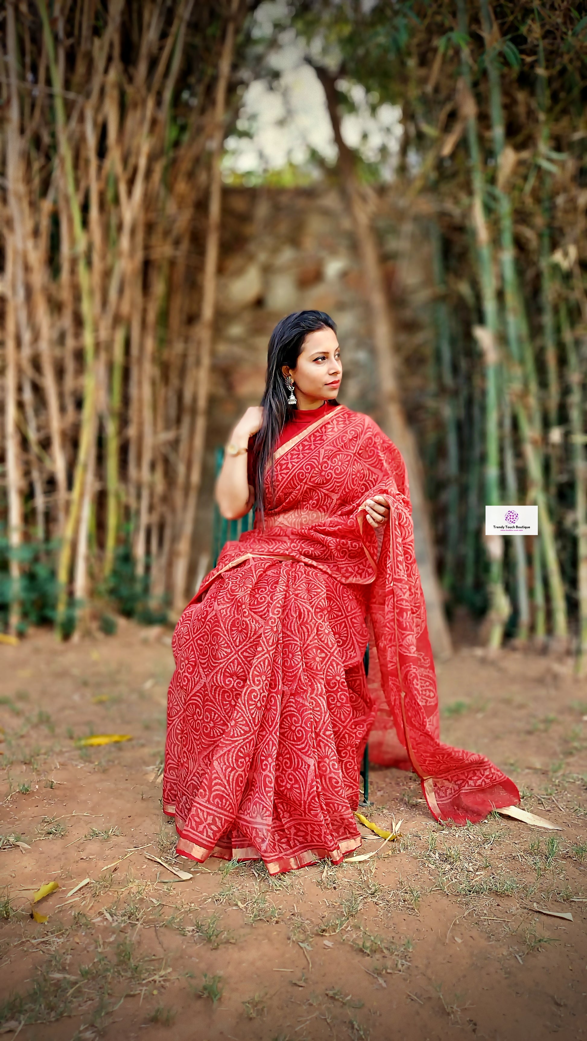 Hand block printed maroon Kota Doria saree with natural dyes, floral and paisley patterns, lightweight and skin-friendly.