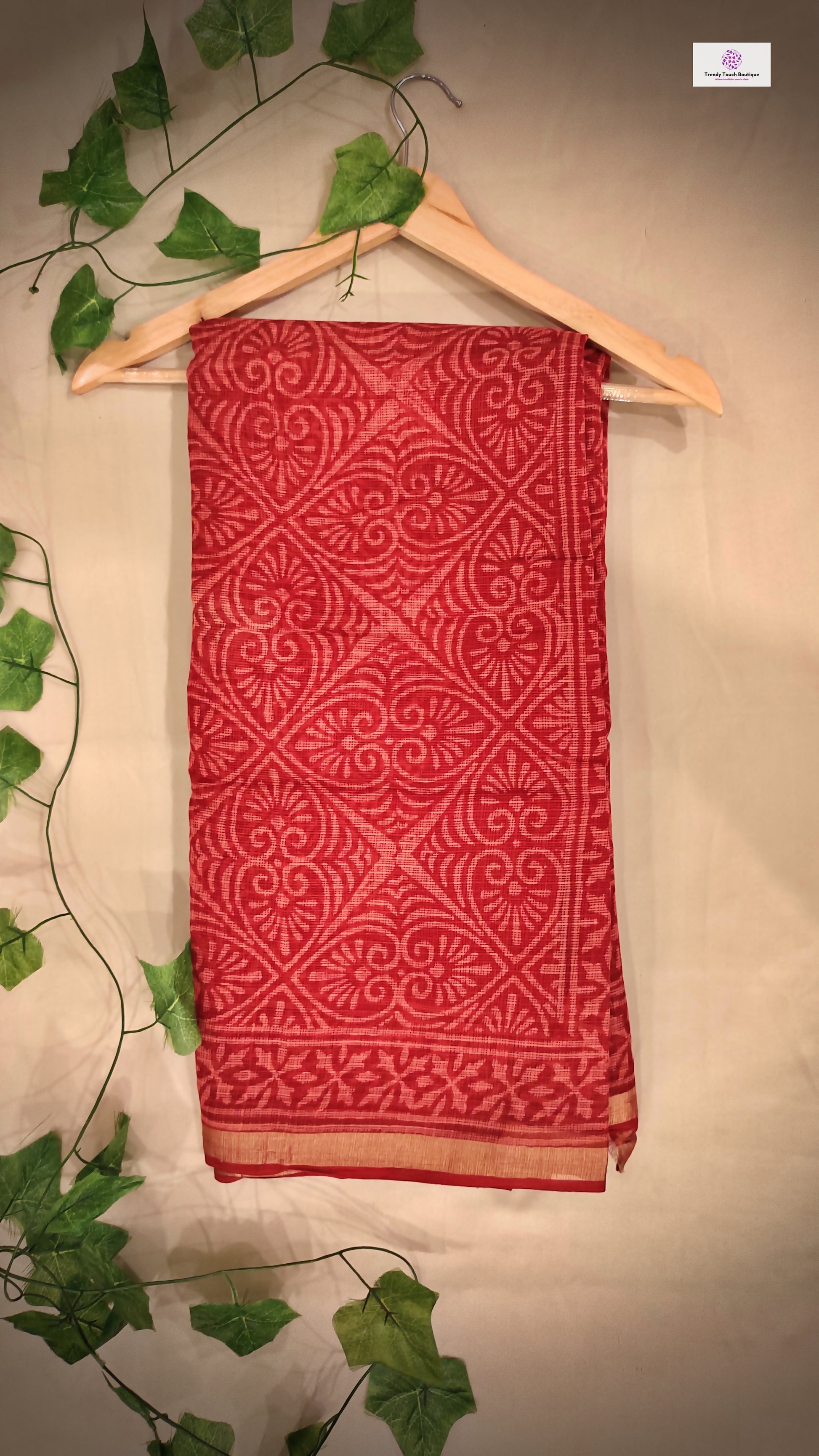 Hand block printed maroon Kota Doria saree with natural dyes, floral and paisley patterns, lightweight and skin-friendly.