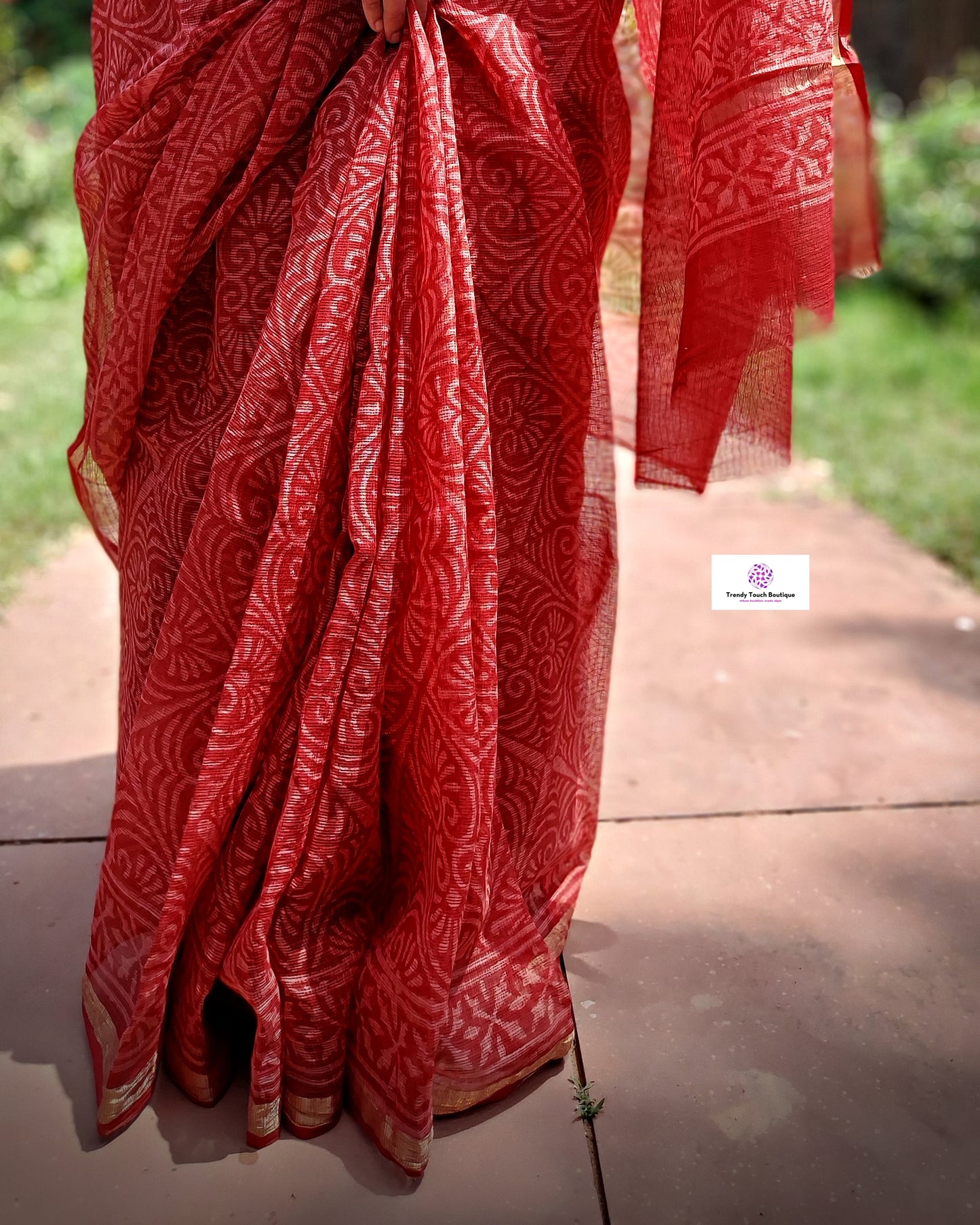 Hand block printed maroon Kota Doria saree with natural dyes, floral and paisley patterns, lightweight and skin-friendly.
