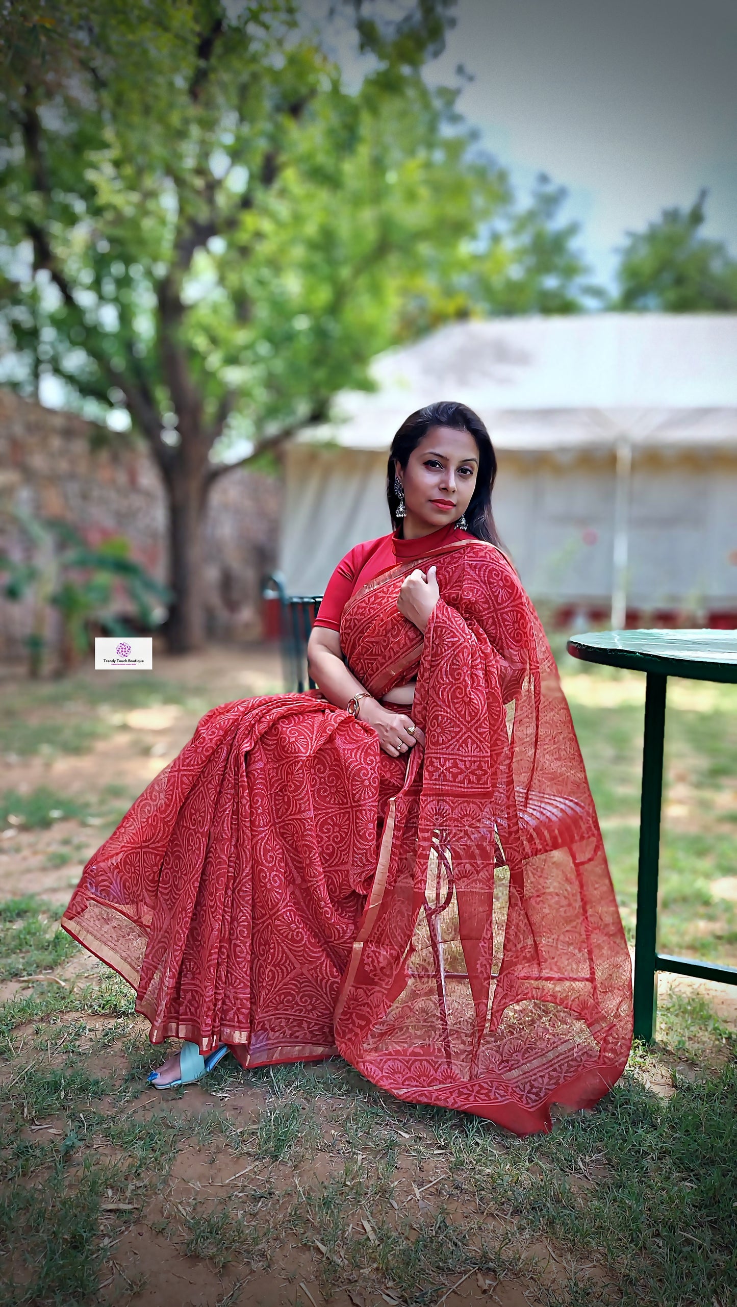 Hand block printed maroon Kota Doria saree with natural dyes, floral and paisley patterns, lightweight and skin-friendly.