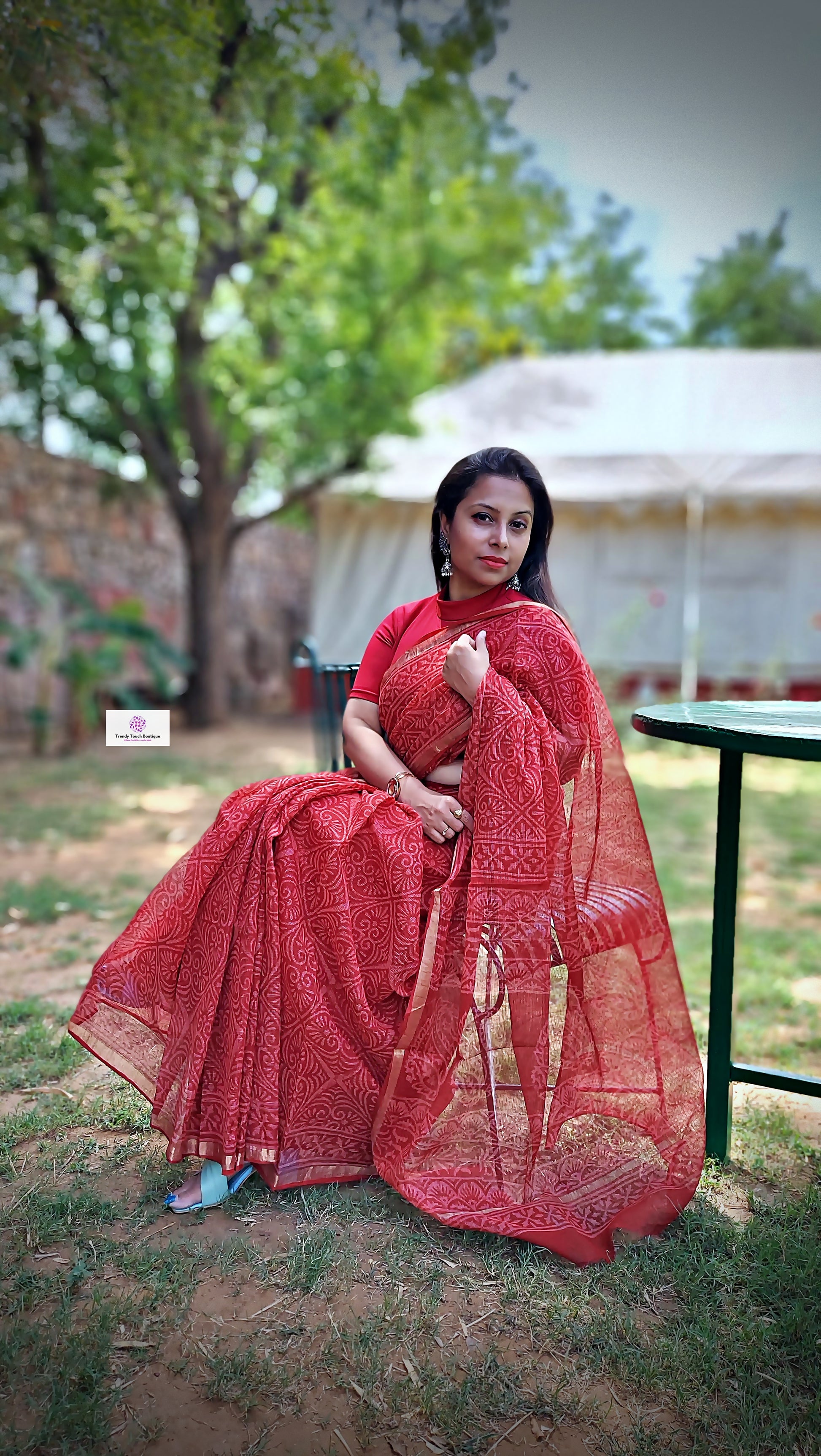 Hand block printed maroon Kota Doria saree with natural dyes, floral and paisley patterns, lightweight and skin-friendly.
