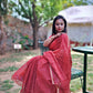 Hand block printed maroon Kota Doria saree with natural dyes, floral and paisley patterns, lightweight and skin-friendly.