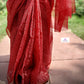 Hand block printed maroon Kota Doria saree with natural dyes, floral and paisley patterns, lightweight and skin-friendly.