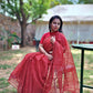 Hand block printed maroon Kota Doria saree with natural dyes, floral and paisley patterns, lightweight and skin-friendly.